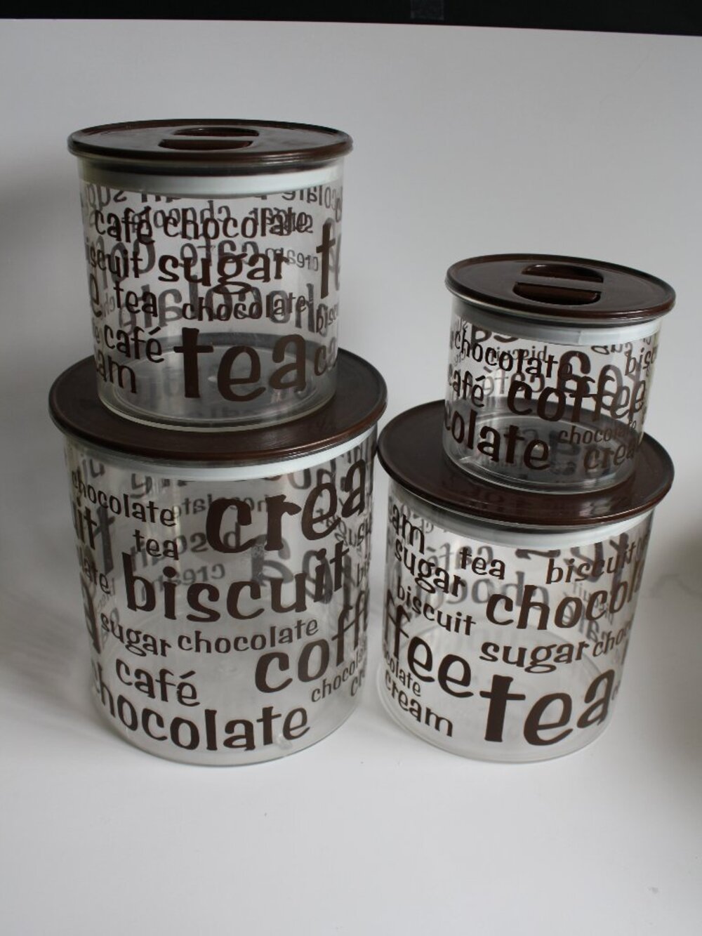 Set of 4 vintage Canisters Brown lettering and lids clear plastic kitchen pantry